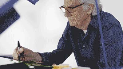 Paul Smith signing the lime green battery of his converted MINI Recharged model.